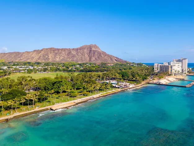 Aerial view of Waikiki Beach with Diamond Head crater rising over Honolulu, Oahu, Hawaii