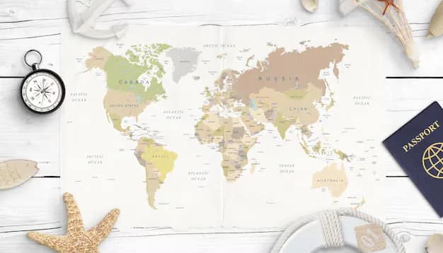 Passport, compass and shells on a world map