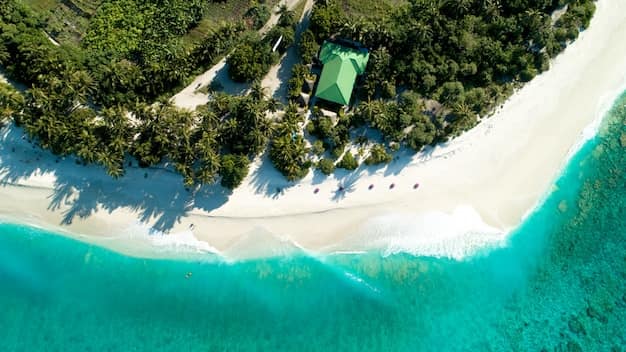 Aerial view of a Maldives island, its beach and lagoon