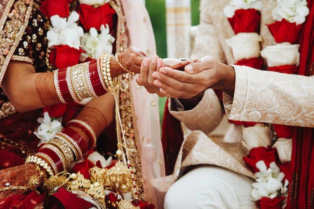 Hands of an Indian bride and groom intertwined during a wedding ritual