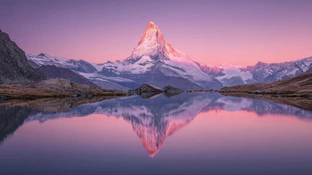 The Matterhorn reflected in an alpine lake at sunrise, Switzerland