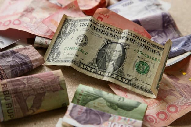 A pile of banknotes from different countries