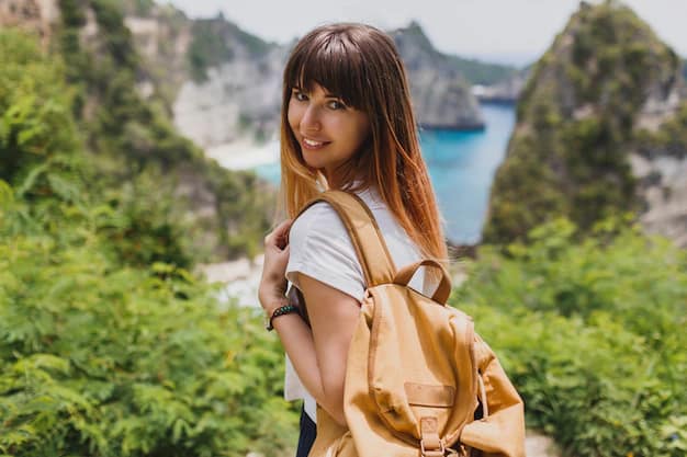 Woman with a backpack travelling solo on Nusa Penida island