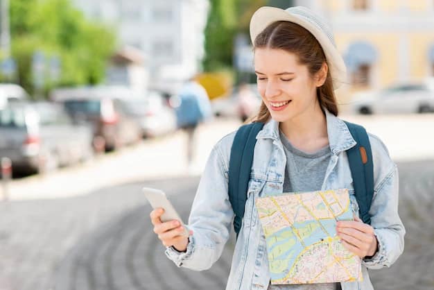 A traveller using a map and mobile phone