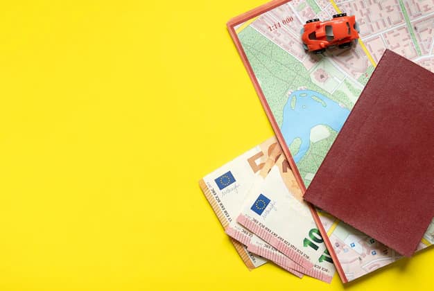 Passport, ticket and travel money laid out for a trip